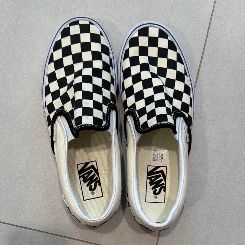 Vans Black and White Checkerboard Slip-On Sneakers